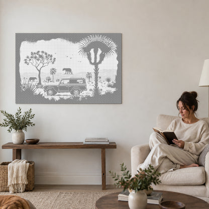 Dot-painting canvas “Adventure in the Wilderness”, on a living-room wall with a person reading in an armchair nearby.