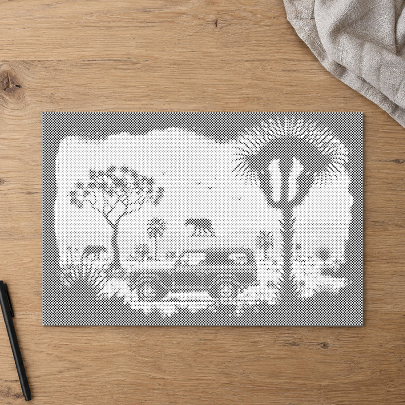 Dot-painting canvas “Adventure in the Wilderness”, seen from above on a worktable in soft daylight.