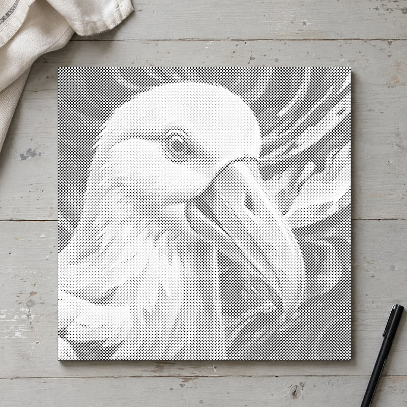 Dot-painting canvas “Albatross”, seen from above on a worktable in soft daylight.