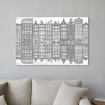 Dot-painting canvas “Amsterdam Houses”, displayed on a light wall in a softly lit room.