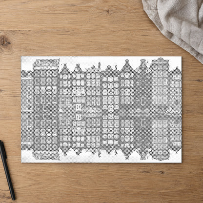 Dot-painting canvas “Amsterdam Houses”, seen from above on a worktable in soft daylight.