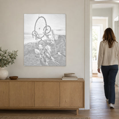 Dot-painting canvas “Dreamcatcher in the Wind”, on a light wall with a person walking through the doorway nearby.