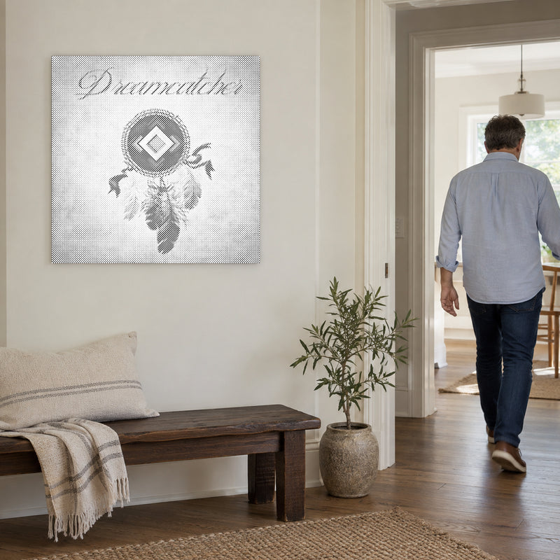 Dot-painting canvas “Dreamcatcher with Feathers”, on a light wall with a person walking through the doorway nearby.