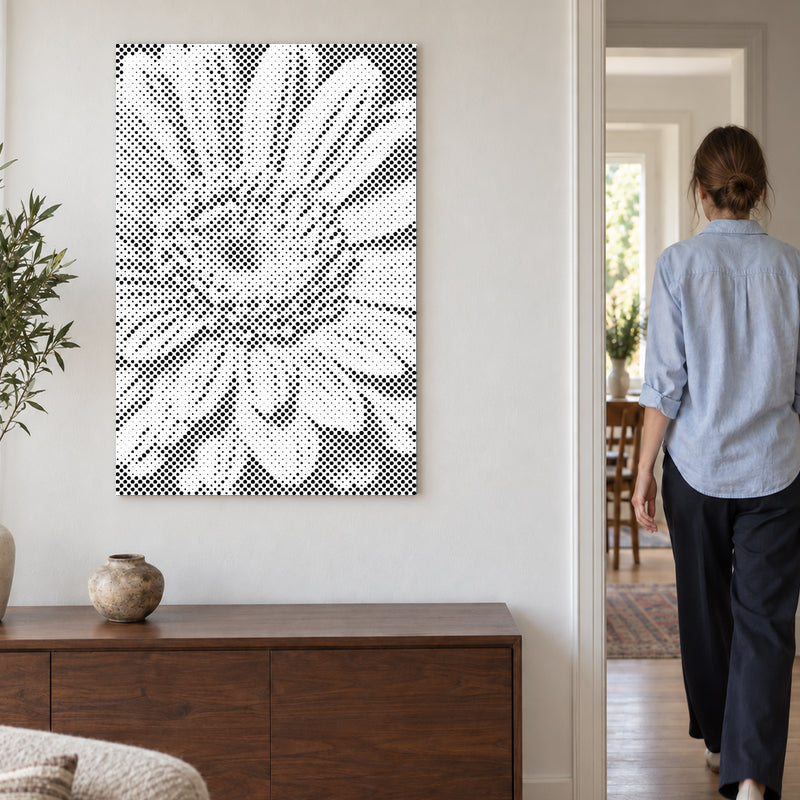 Dot-painting canvas “Gerbera Flower”, on a light wall with a person walking through the doorway nearby.