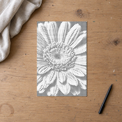 Dot-painting canvas “Gerbera Flower”, seen from above on a worktable in soft daylight.