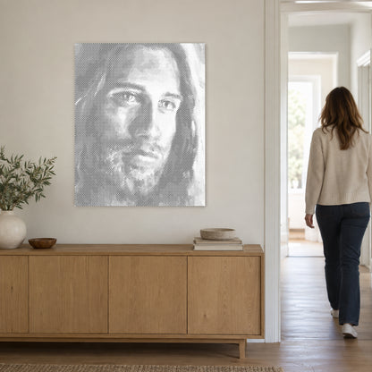Dot-painting canvas “Jesus Christ”, on a light wall with a person walking through the doorway nearby.