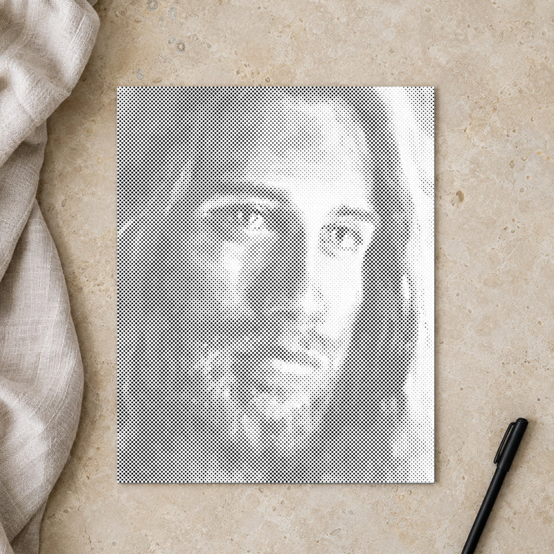 Dot-painting canvas “Jesus Christ”, seen from above on a worktable in soft daylight.