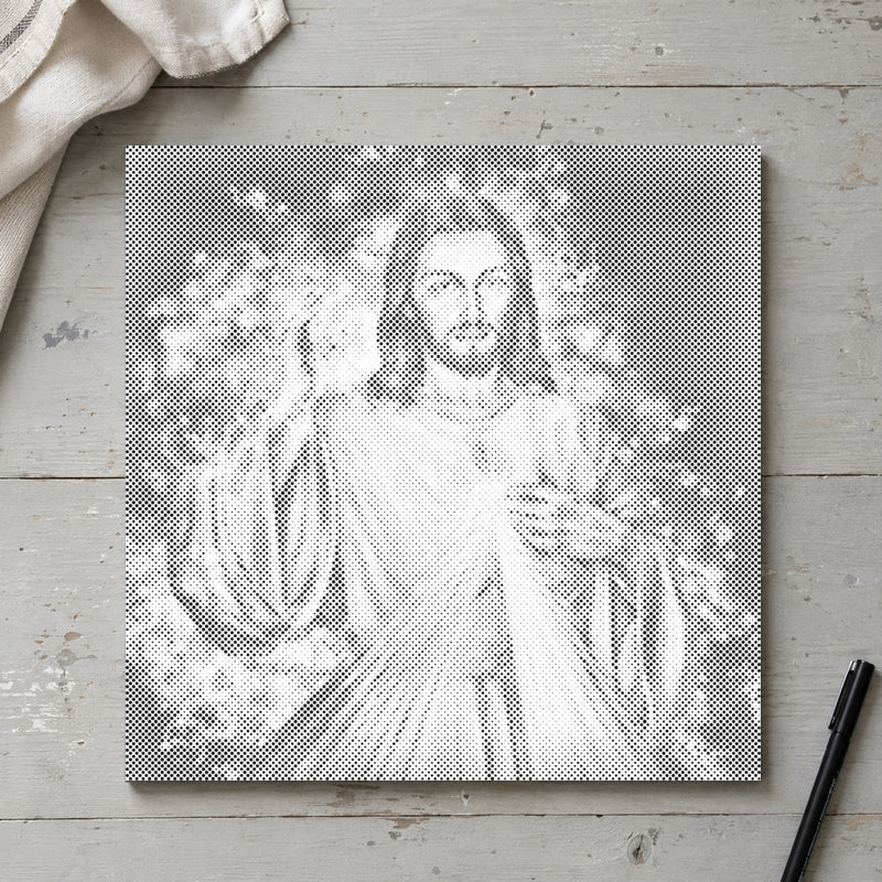 Dot-painting canvas “Jesus: The Sequel”, seen from above on a worktable in soft daylight.