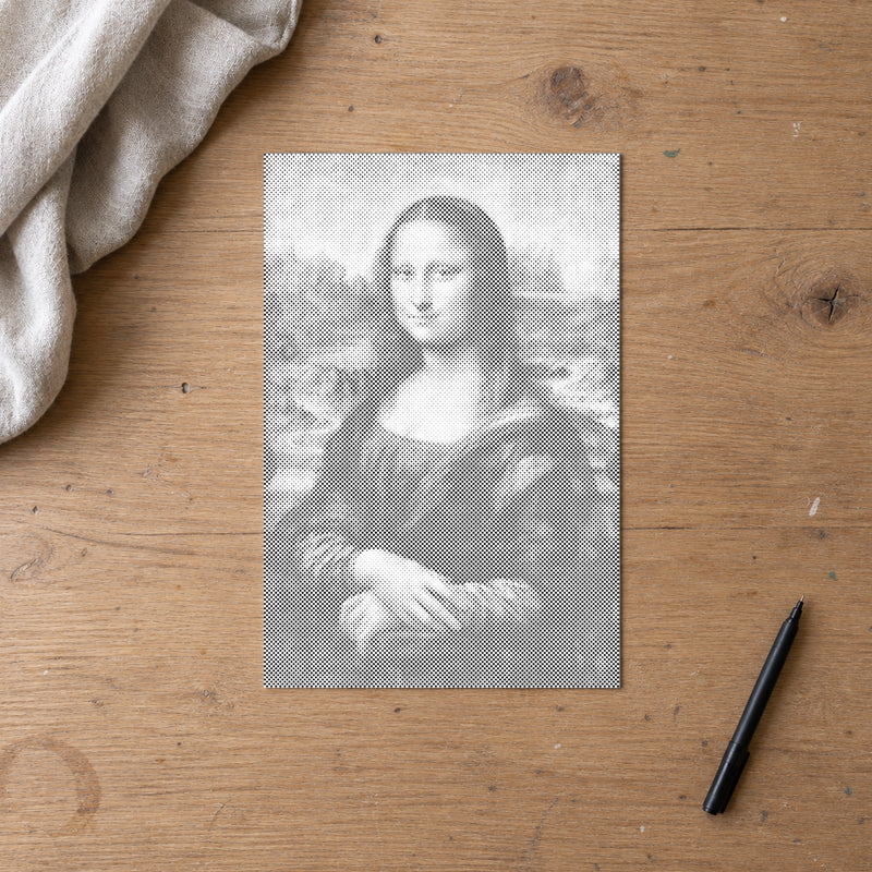Dot-painting canvas “Mona Lisa by Leonardo da Vinci”, seen from above on a worktable in soft daylight.