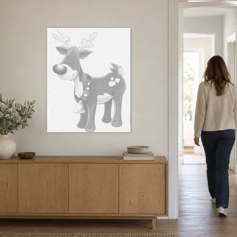 Dot-painting canvas “Rudolph the Red Nosed Reindeer”, on a light wall with a person walking through the doorway nearby.