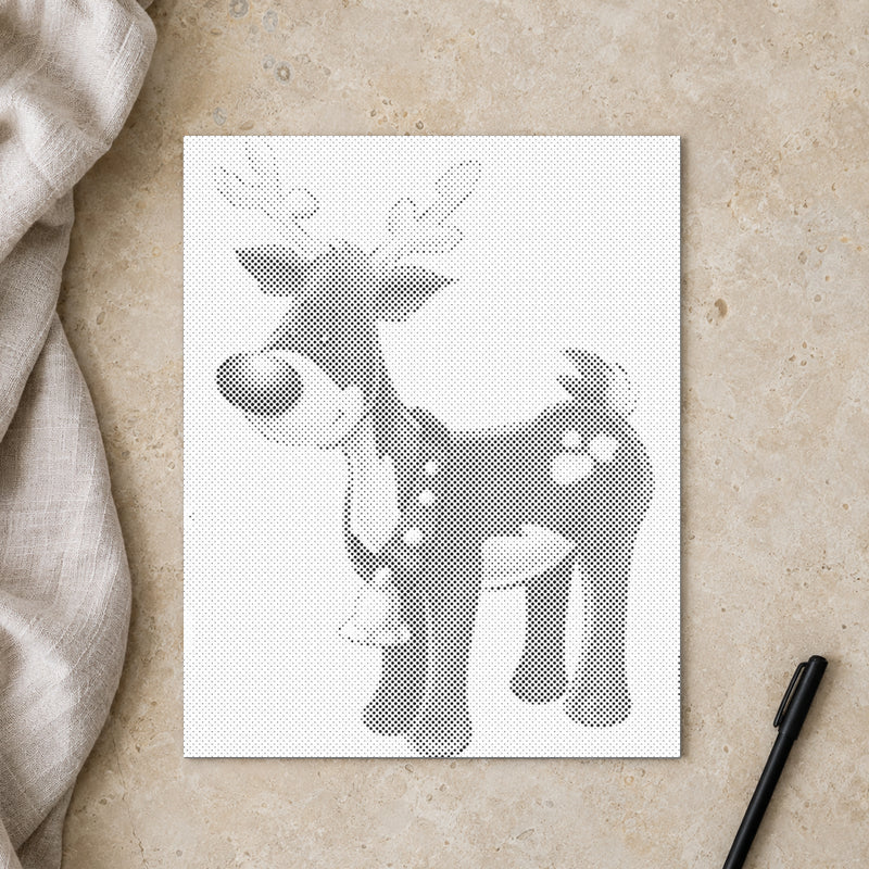 Dot-painting canvas “Rudolph the Red Nosed Reindeer”, seen from above on a worktable in soft daylight.