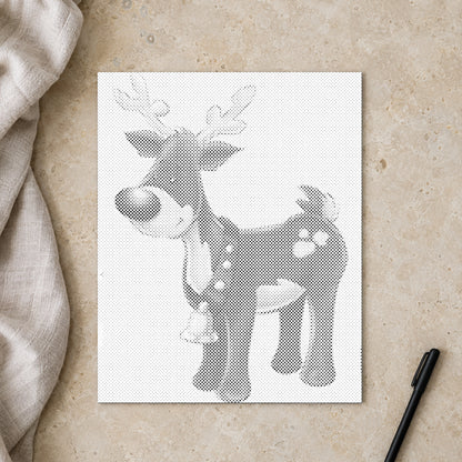 Dot-painting canvas “Rudolph the Red Nosed Reindeer”, seen from above on a worktable in soft daylight.