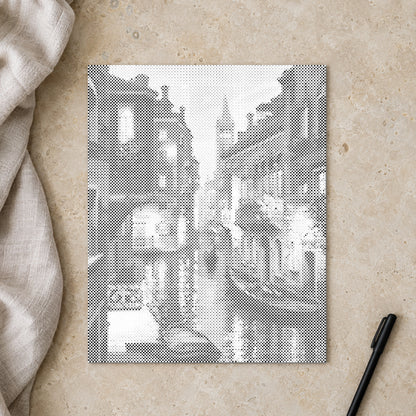 Dot-painting canvas “Venice at Night”, seen from above on a worktable in soft daylight.